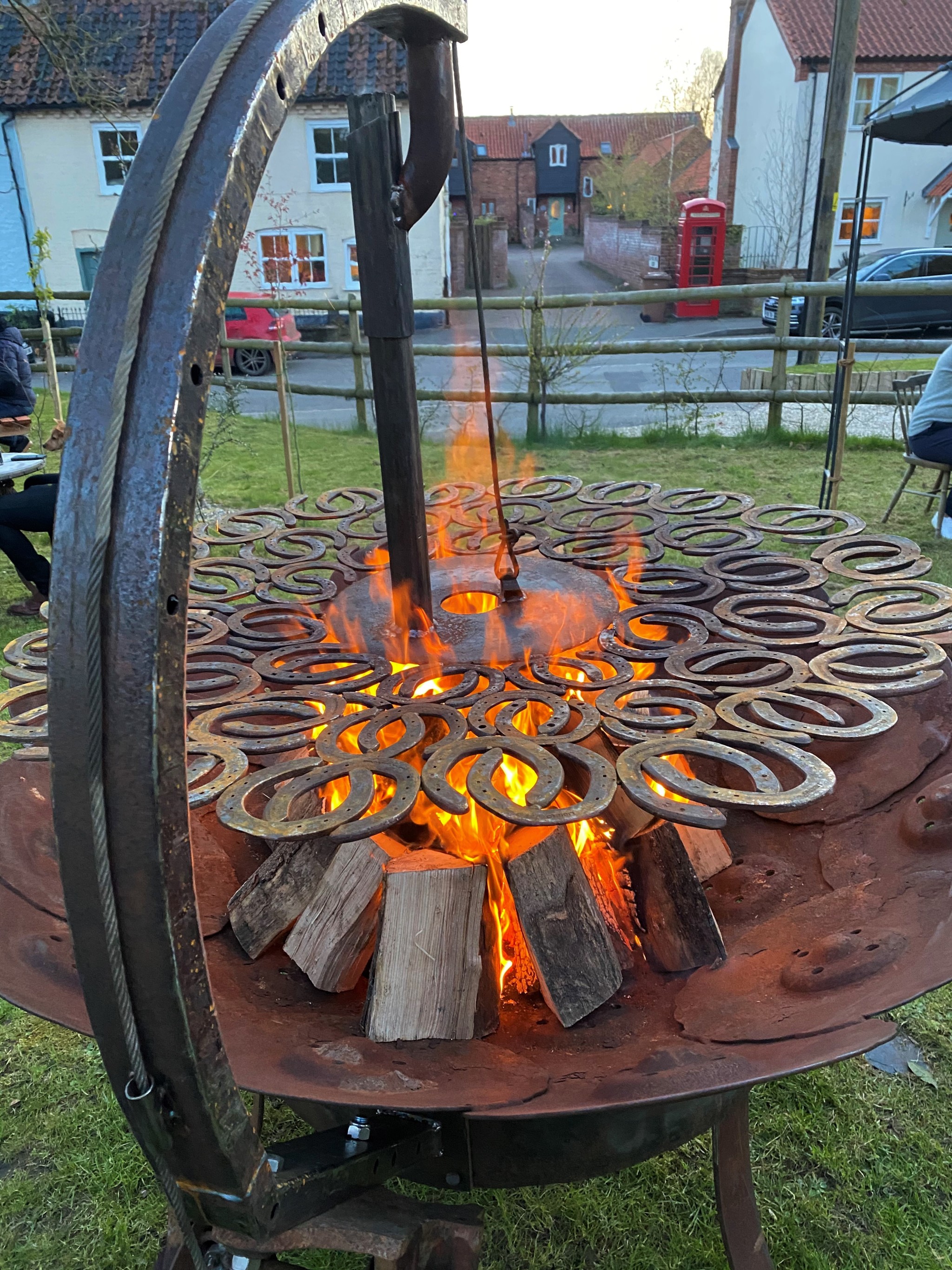 Rose and Crown horse shoe Grill in flame.jpg