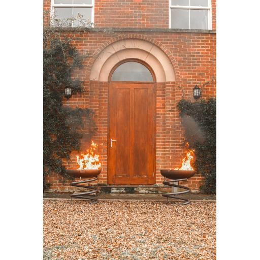 Spring fire bowl pair front of house.jpg